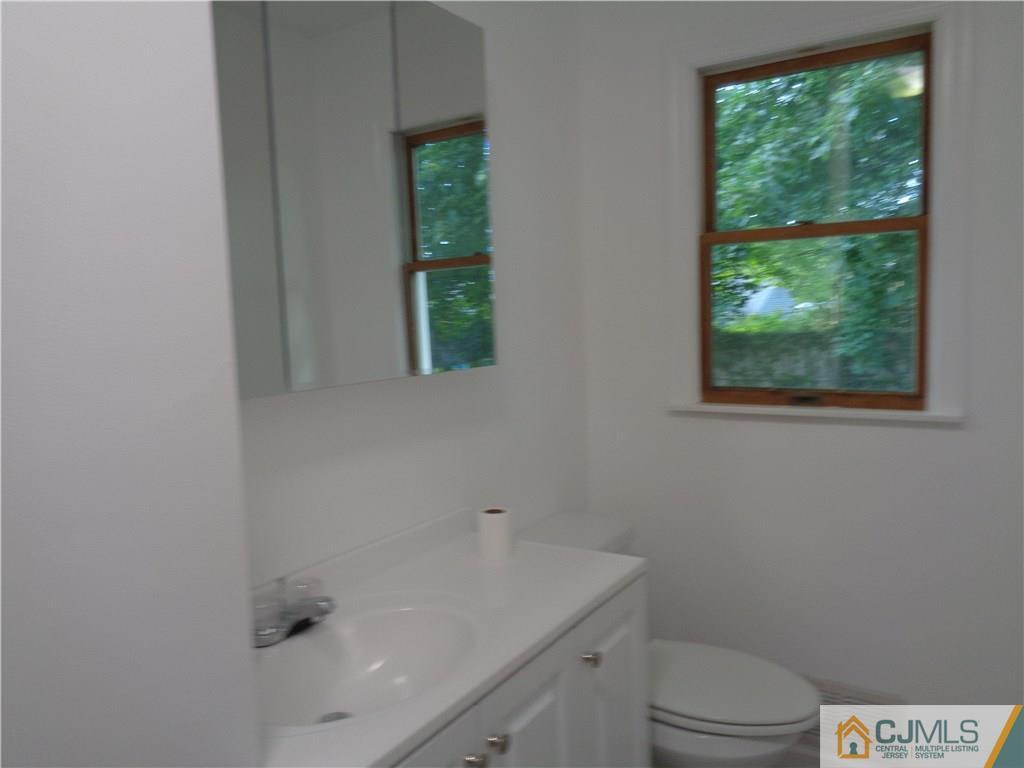 14 Bucknell Road Old Bridge, NJ 08859 - Photo 10 of 15 a bathroom with a sink and a toilet