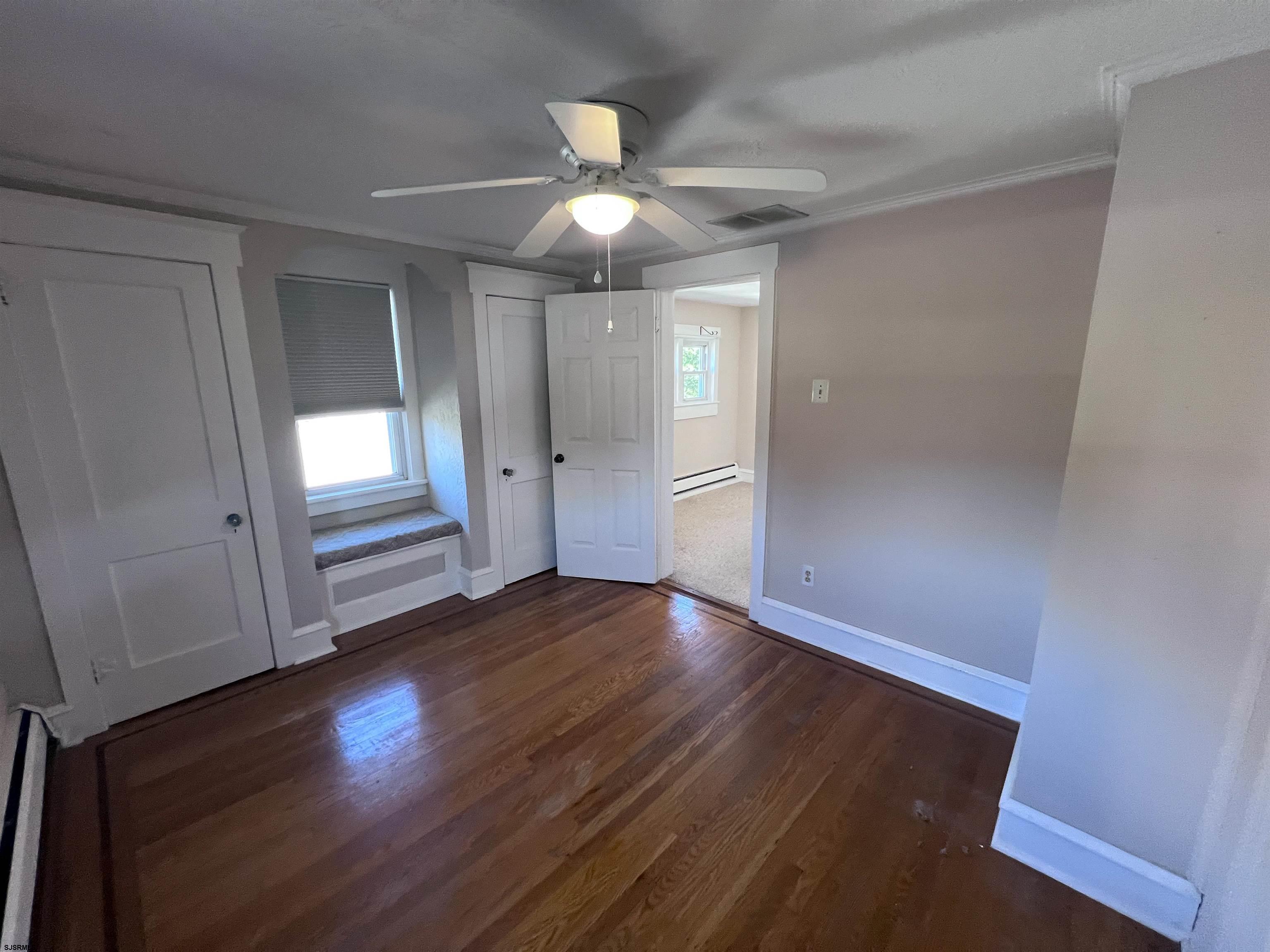 114 Shore Road, Unit YEARLY RENTAL Linwood, NJ 08221 - Photo 15 of 39 wooden floor in an empty room with a window