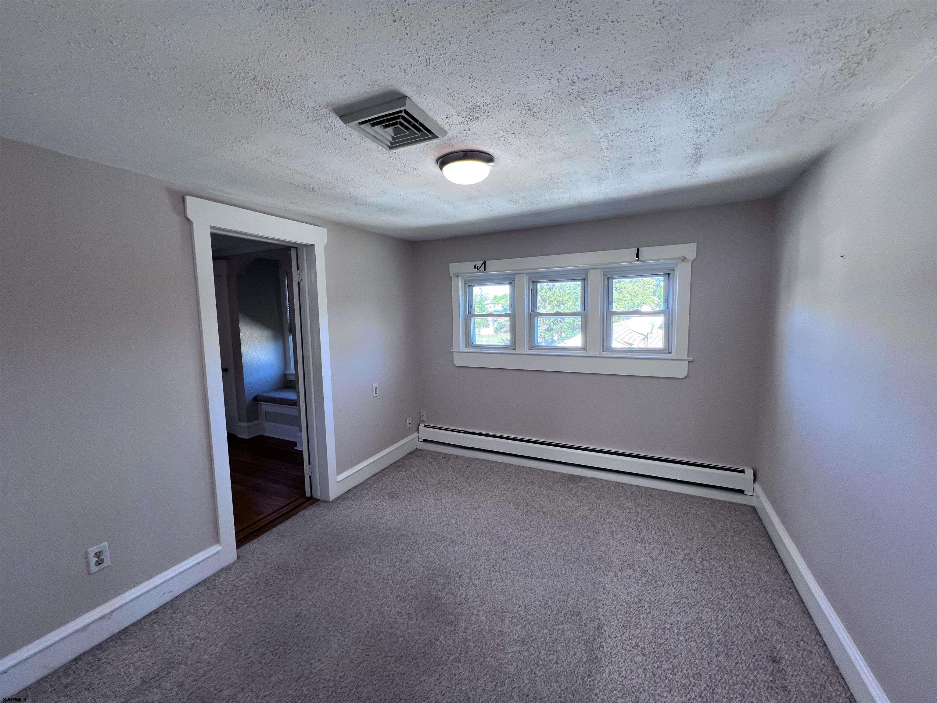 114 Shore Road, Unit YEARLY RENTAL Linwood, NJ 08221 - Photo 16 of 39 an empty room with windows and closet