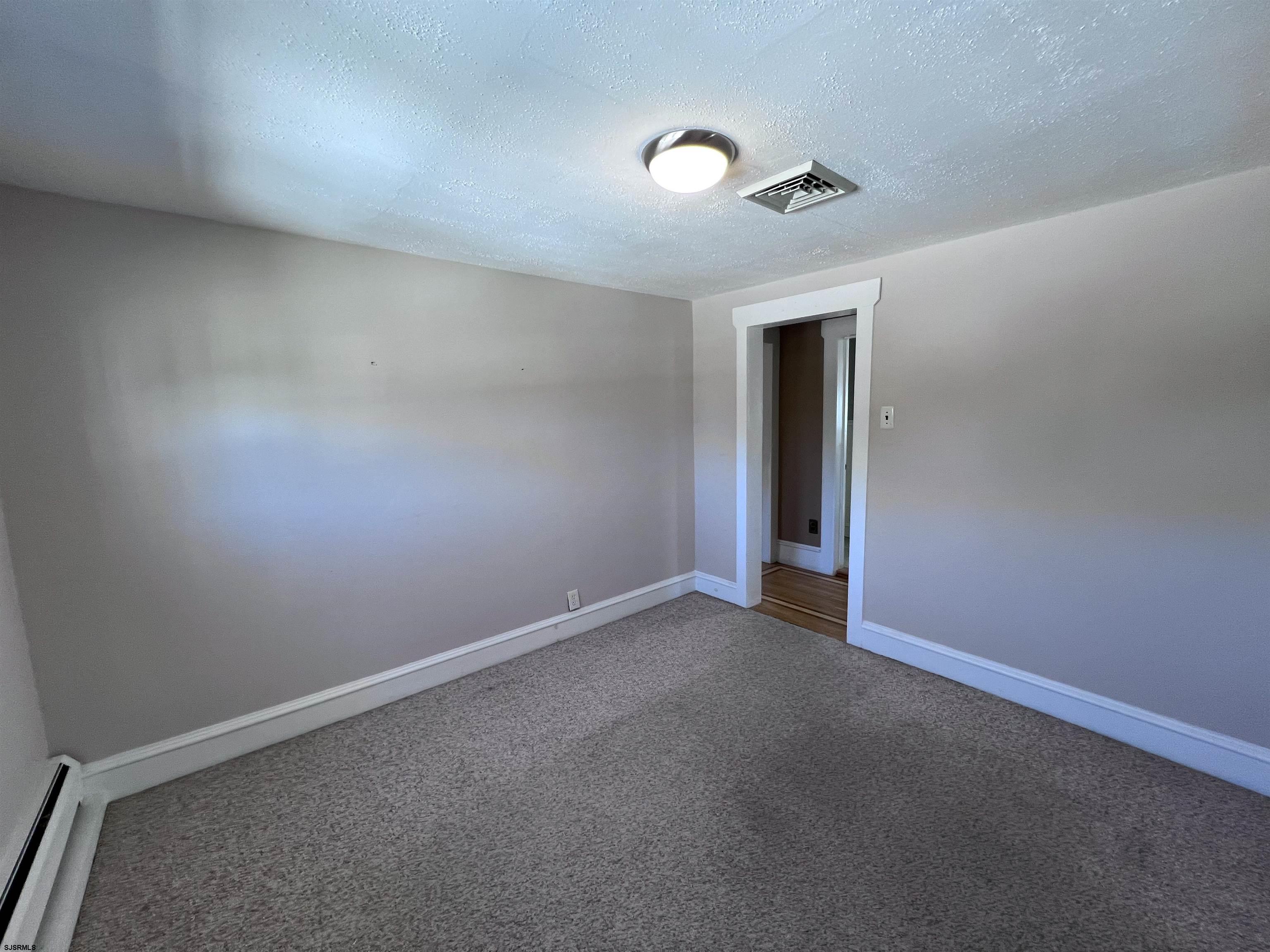 114 Shore Road, Unit YEARLY RENTAL Linwood, NJ 08221 - Photo 17 of 39 an empty room with an empty space and a window