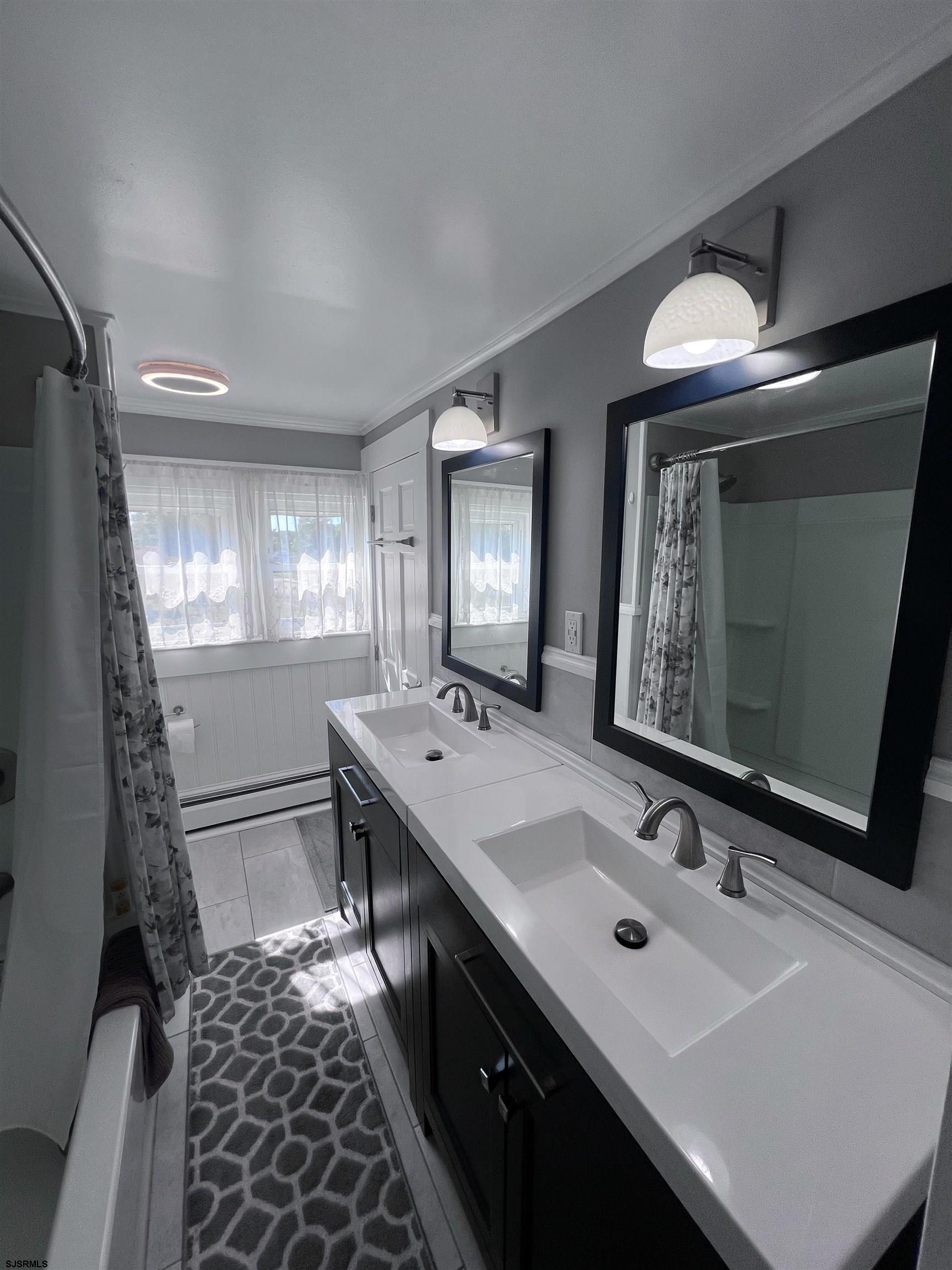 114 Shore Road, Unit YEARLY RENTAL Linwood, NJ 08221 - Photo 19 of 39 a bathroom with a sink and a mirror