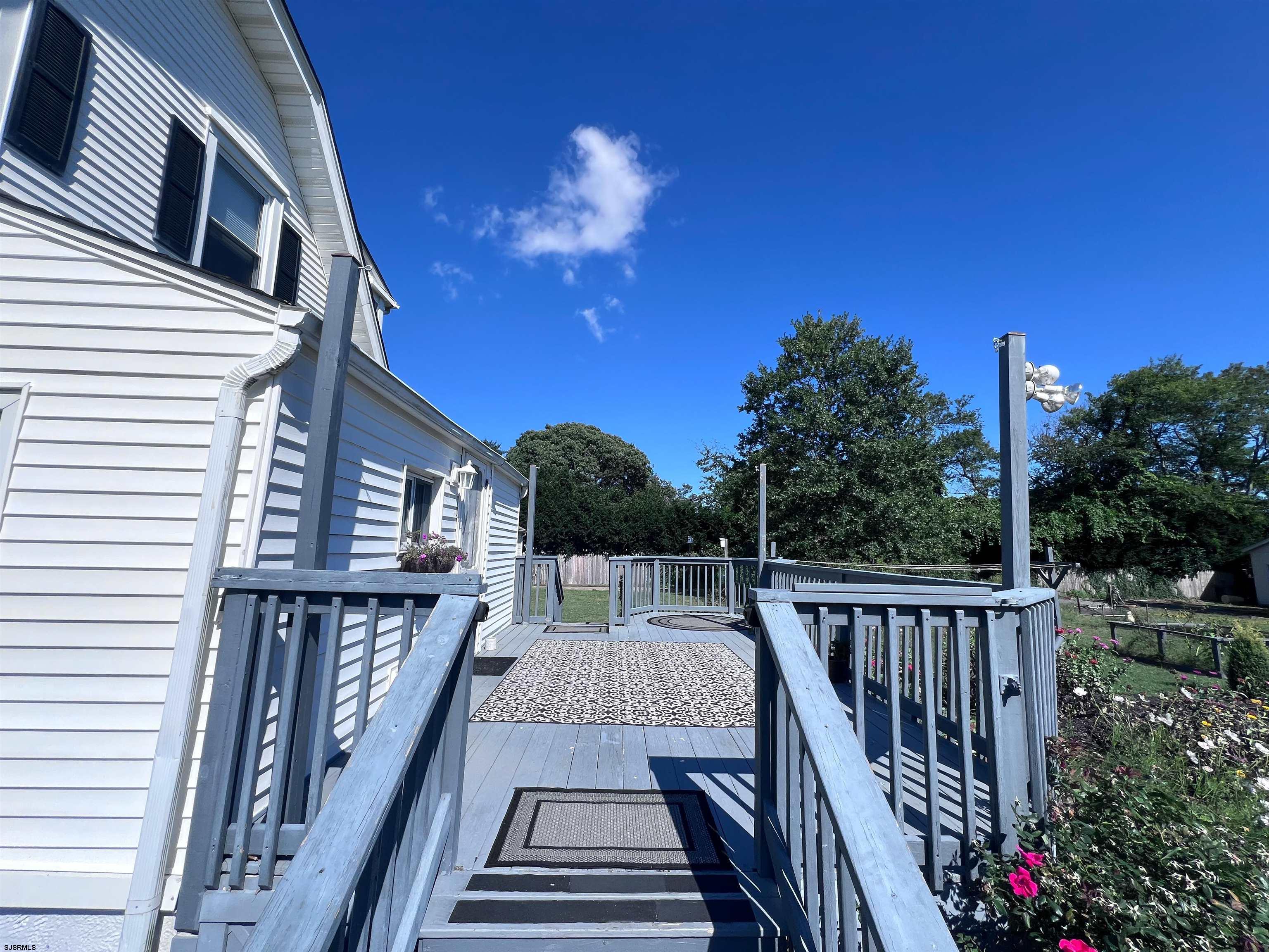 114 Shore Road, Unit YEARLY RENTAL Linwood, NJ 08221 - Photo 26 of 39 a view of a balcony with wooden floor and outdoor space