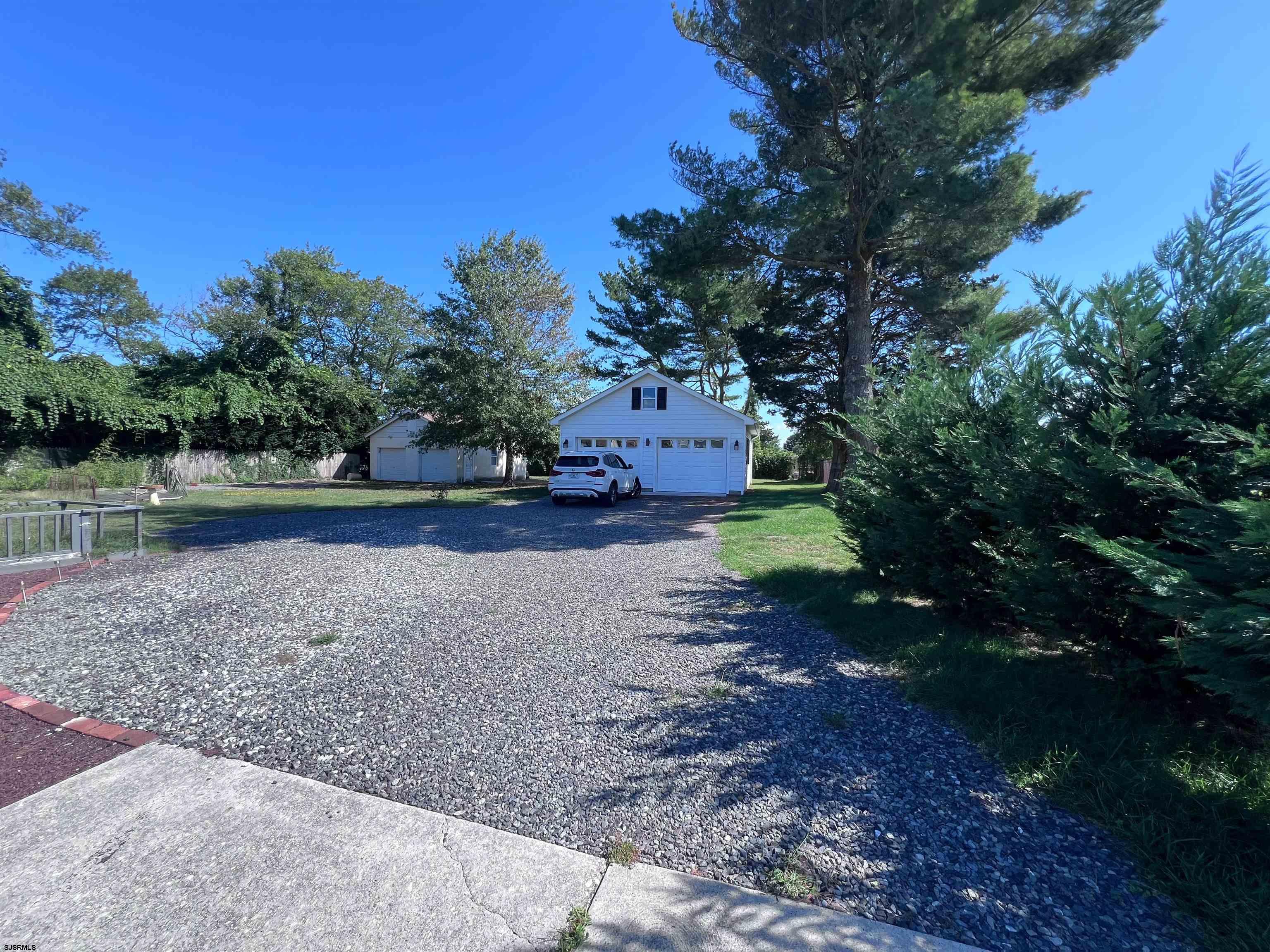 114 Shore Road, Unit YEARLY RENTAL Linwood, NJ 08221 - Photo 28 of 39 a view of a yard with a tree