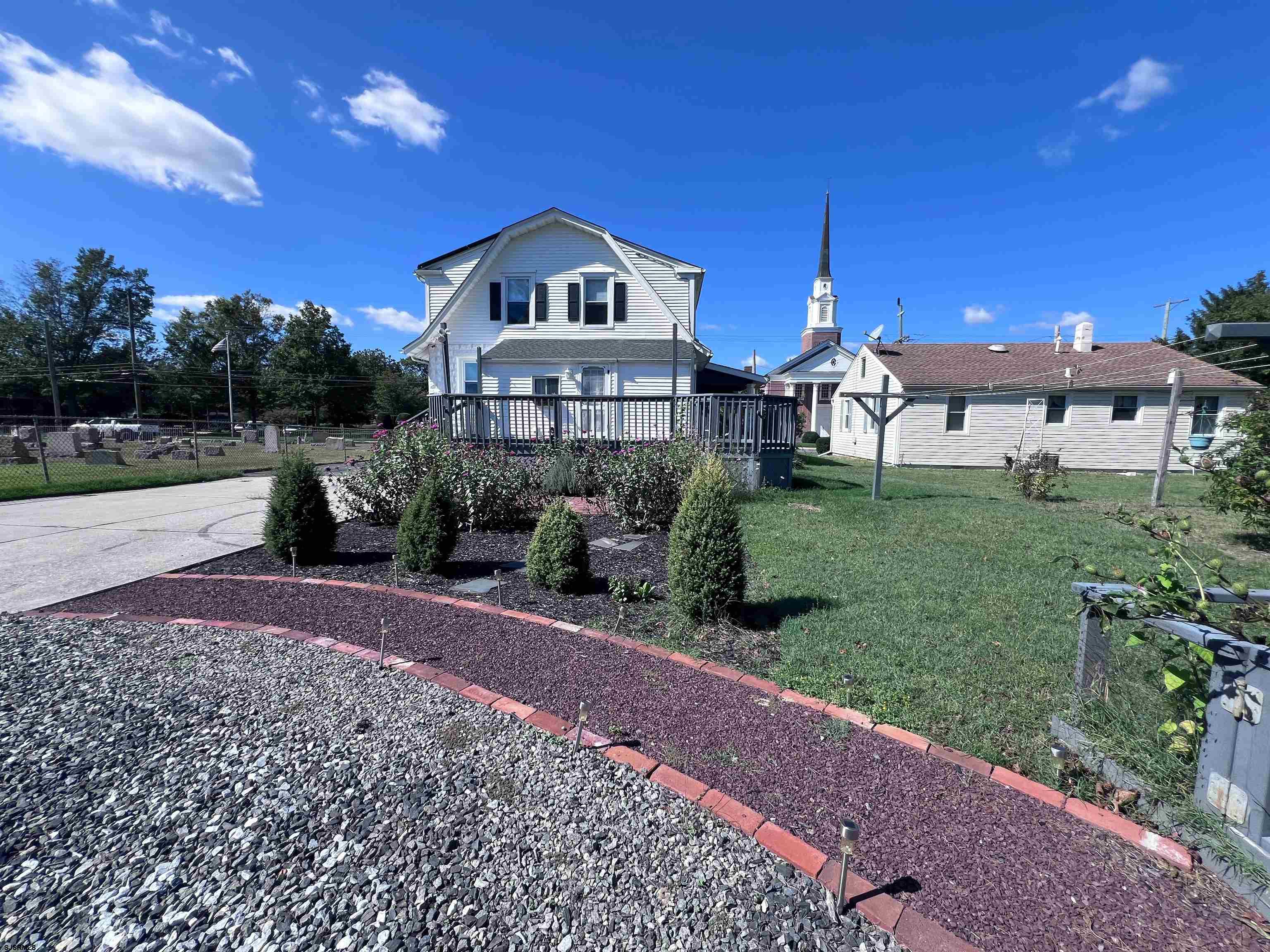 114 Shore Road, Unit YEARLY RENTAL Linwood, NJ 08221 - Photo 30 of 39 a front view of a house with a yard and garage