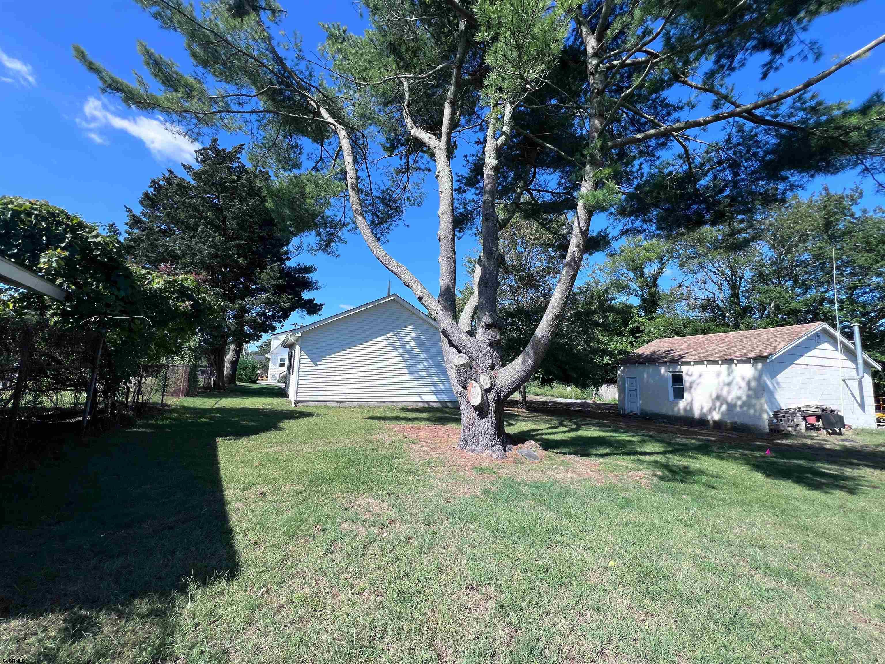 114 Shore Road, Unit YEARLY RENTAL Linwood, NJ 08221 - Photo 32 of 39 a view of a house with a yard
