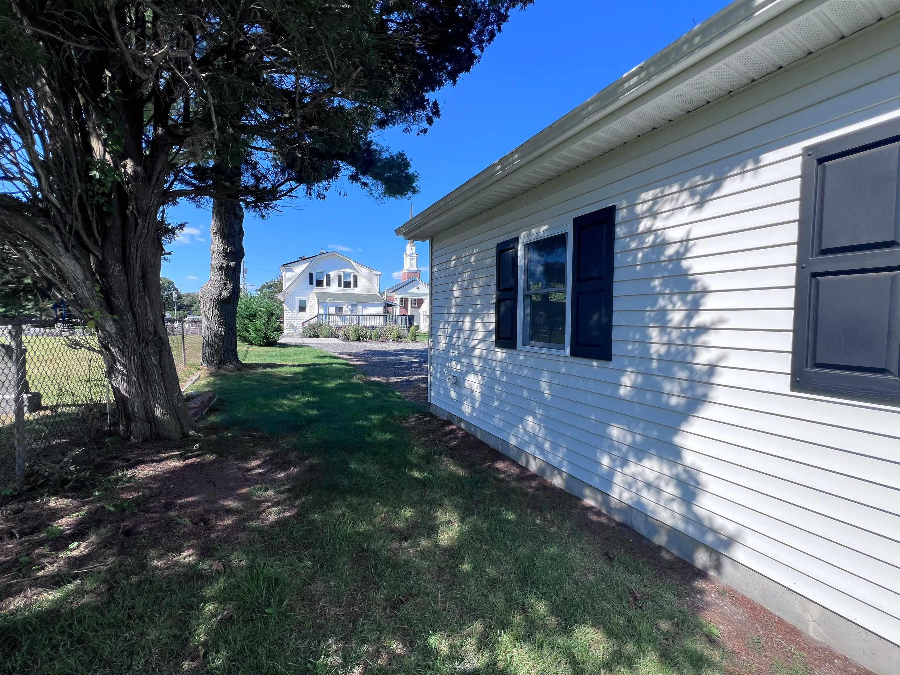 114 Shore Road, Unit YEARLY RENTAL Linwood, NJ 08221 - Photo 33 of 39 a view of a house with a yard