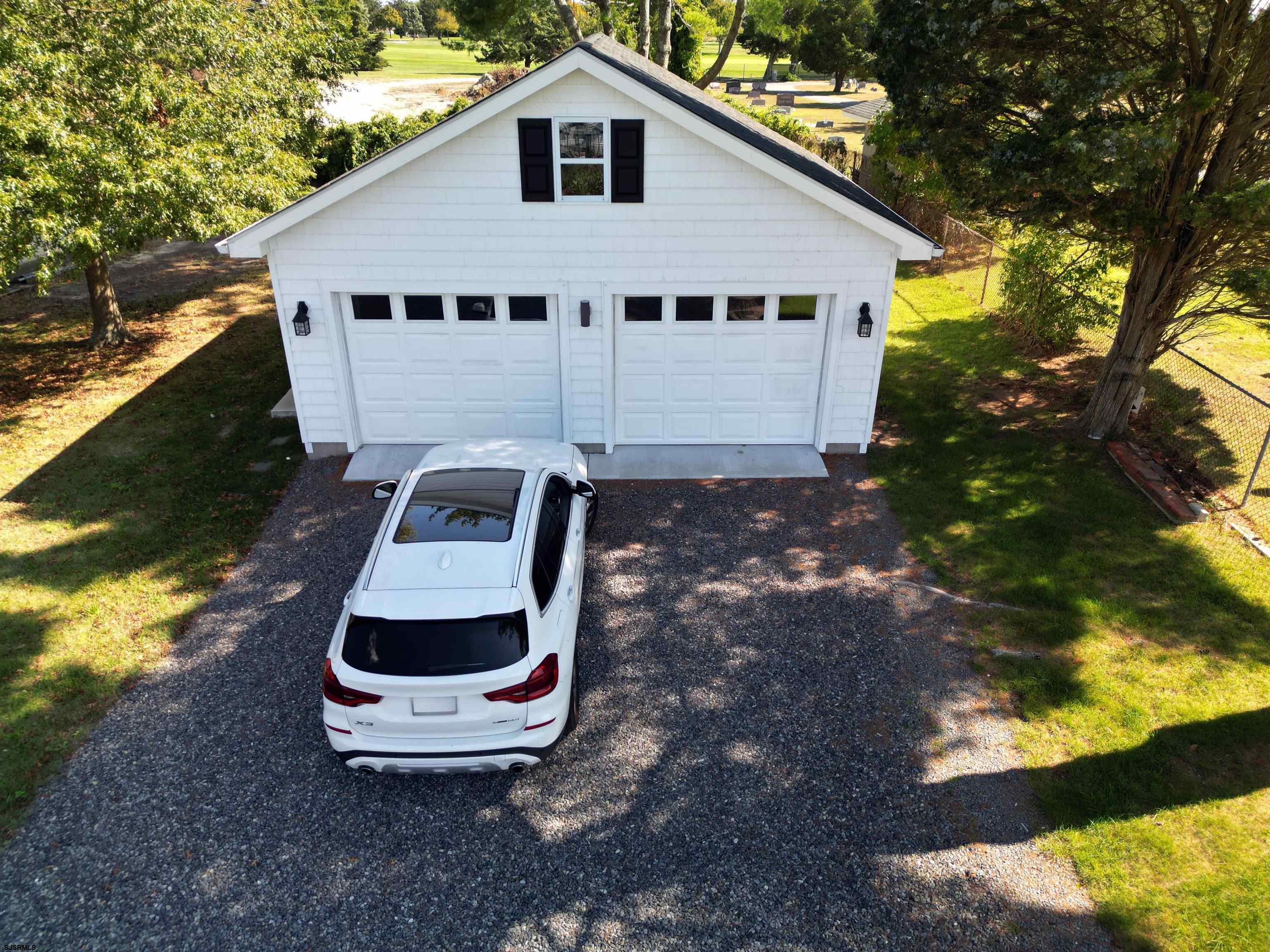 114 Shore Road, Unit YEARLY RENTAL Linwood, NJ 08221 - Photo 34 of 39 a front view of a house with a yard