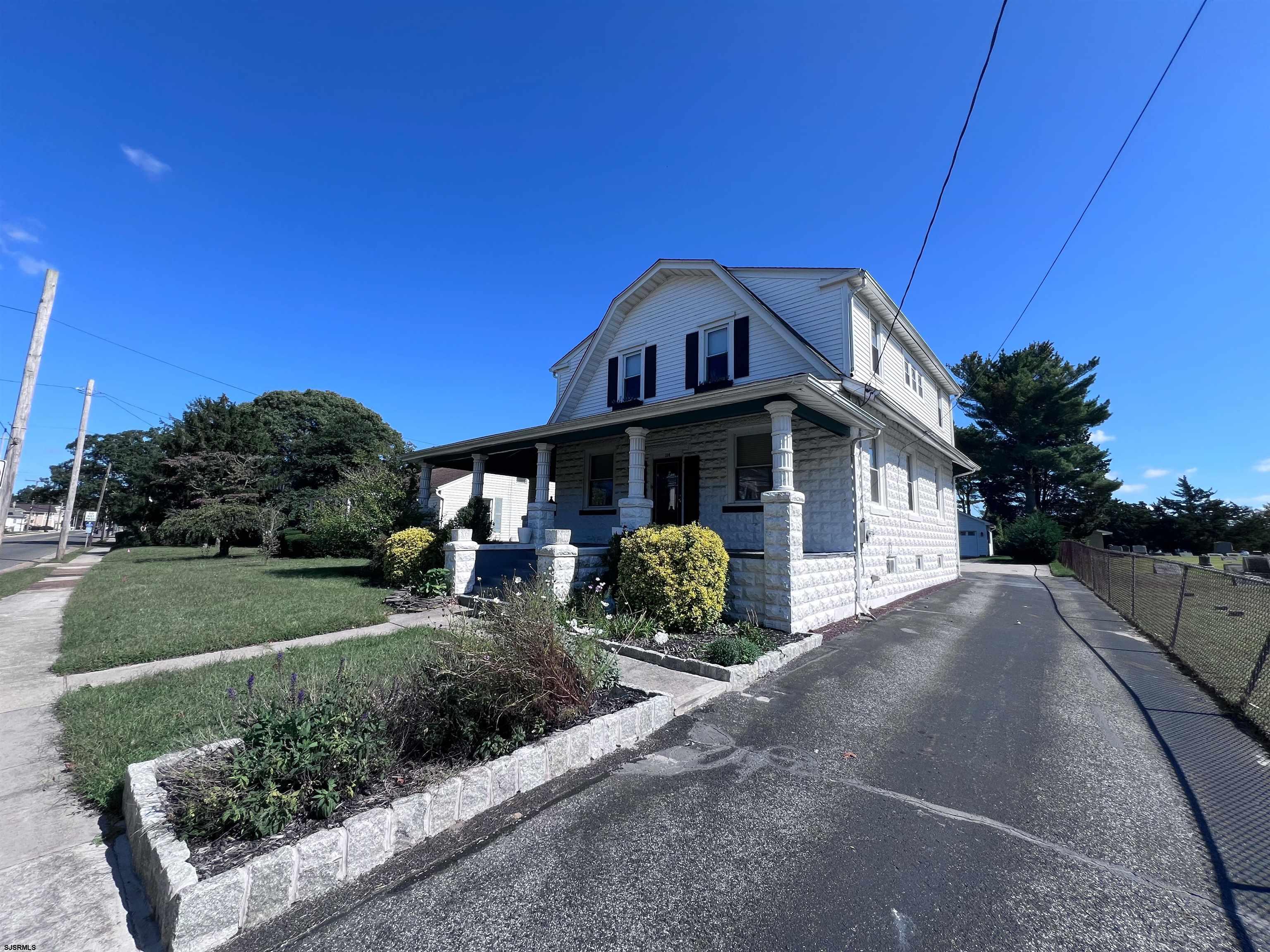 114 Shore Road, Unit YEARLY RENTAL Linwood, NJ 08221 - Photo 39 of 39 a front view of a house with a yard