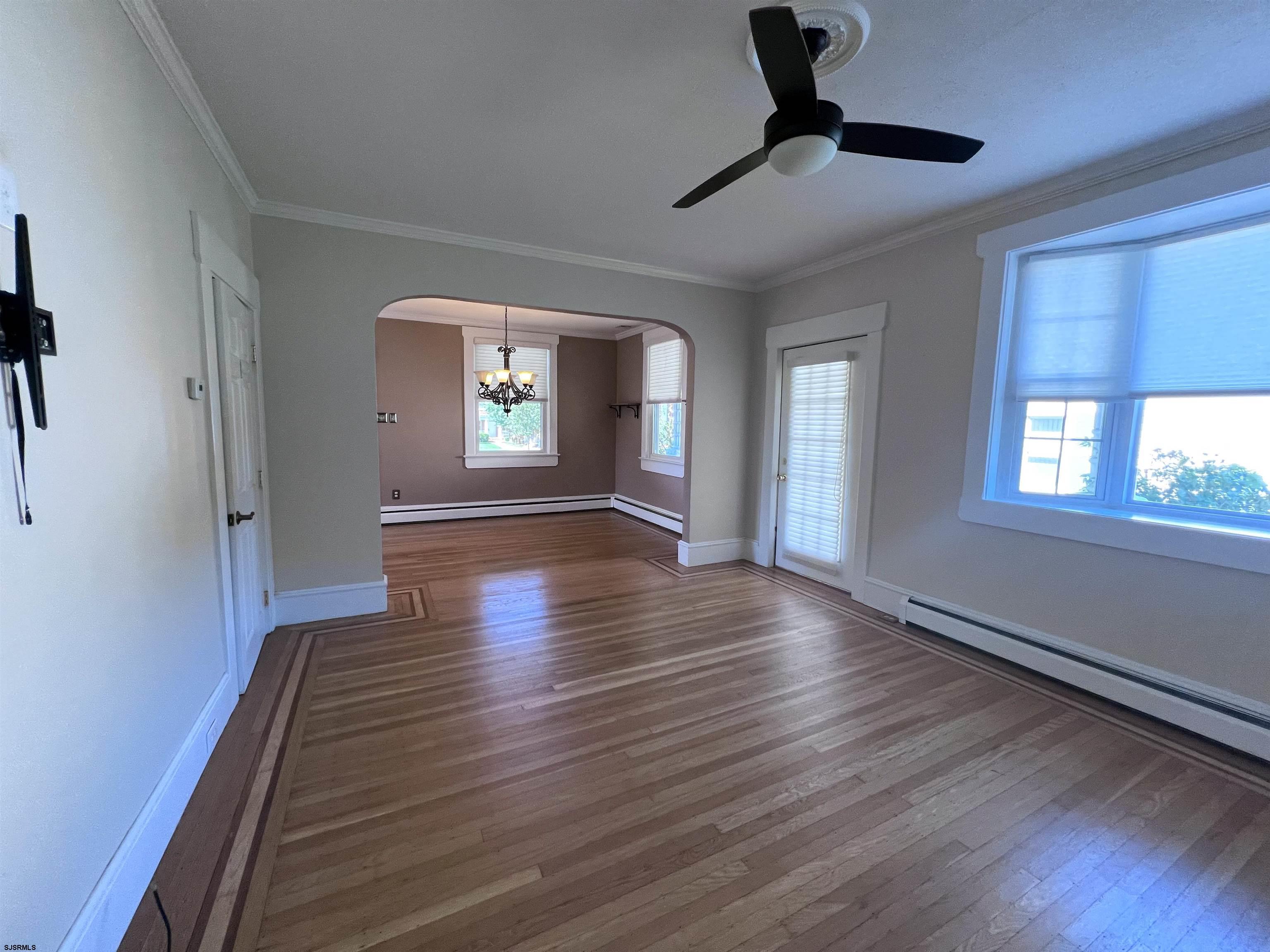 114 Shore Road, Unit YEARLY RENTAL Linwood, NJ 08221 - Photo 6 of 39 a view of an empty room with wooden floor and a window