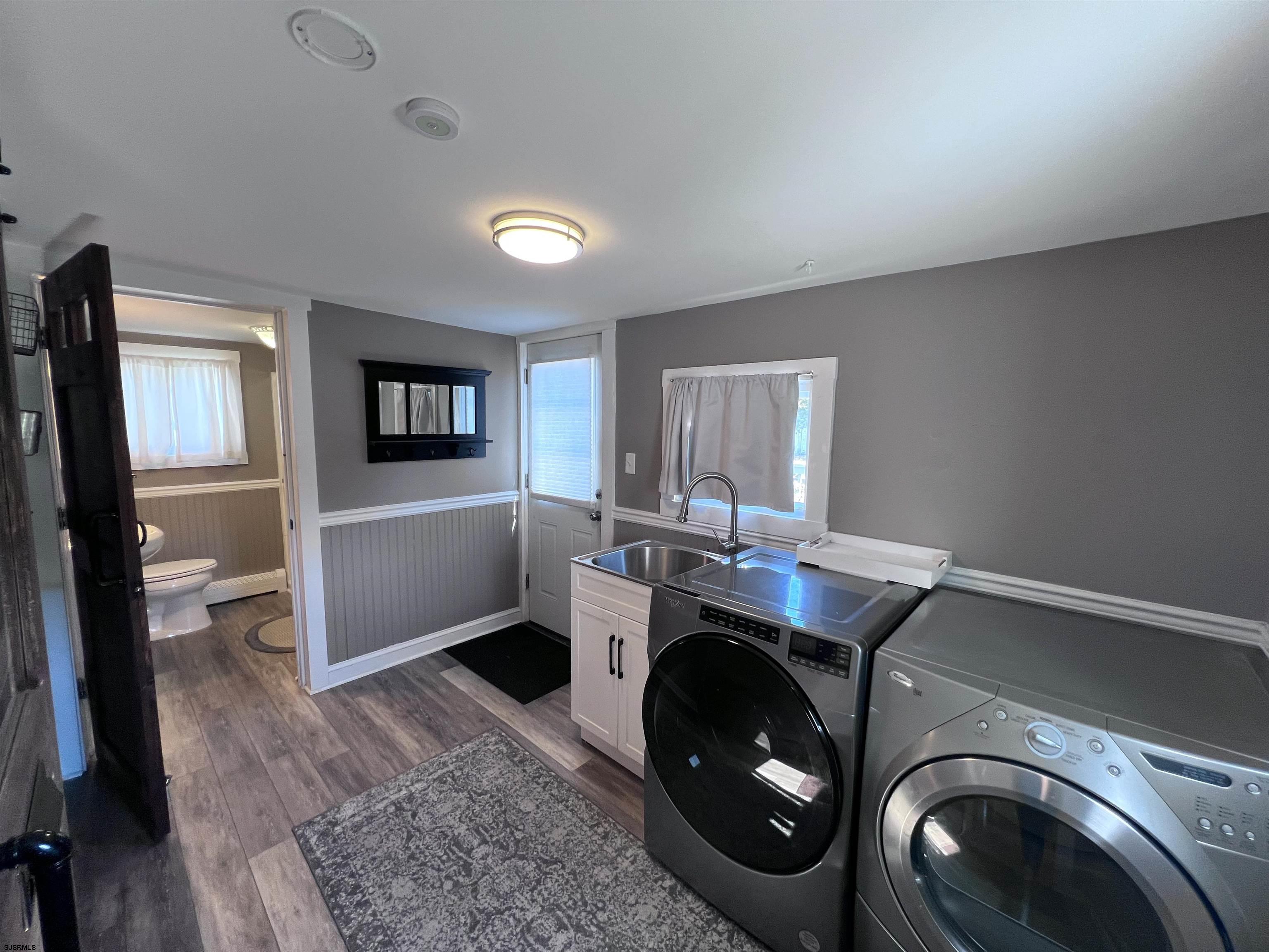 114 Shore Road, Unit YEARLY RENTAL Linwood, NJ 08221 - Photo 9 of 39 a utility room with cabinets dryer and washer