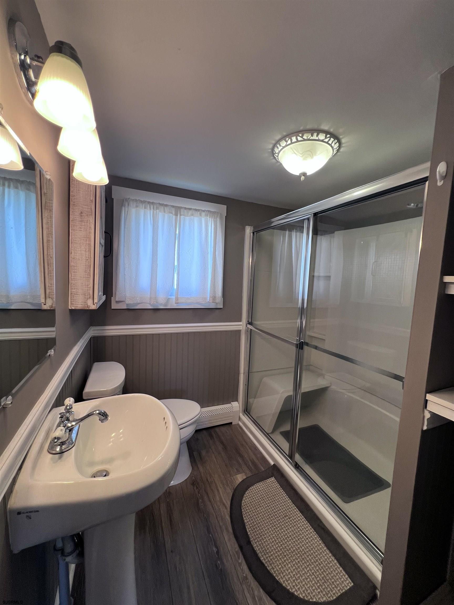 114 Shore Road, Unit YEARLY RENTAL Linwood, NJ 08221 - Photo 10 of 39 a bathroom with a sink a toilet and a mirror
