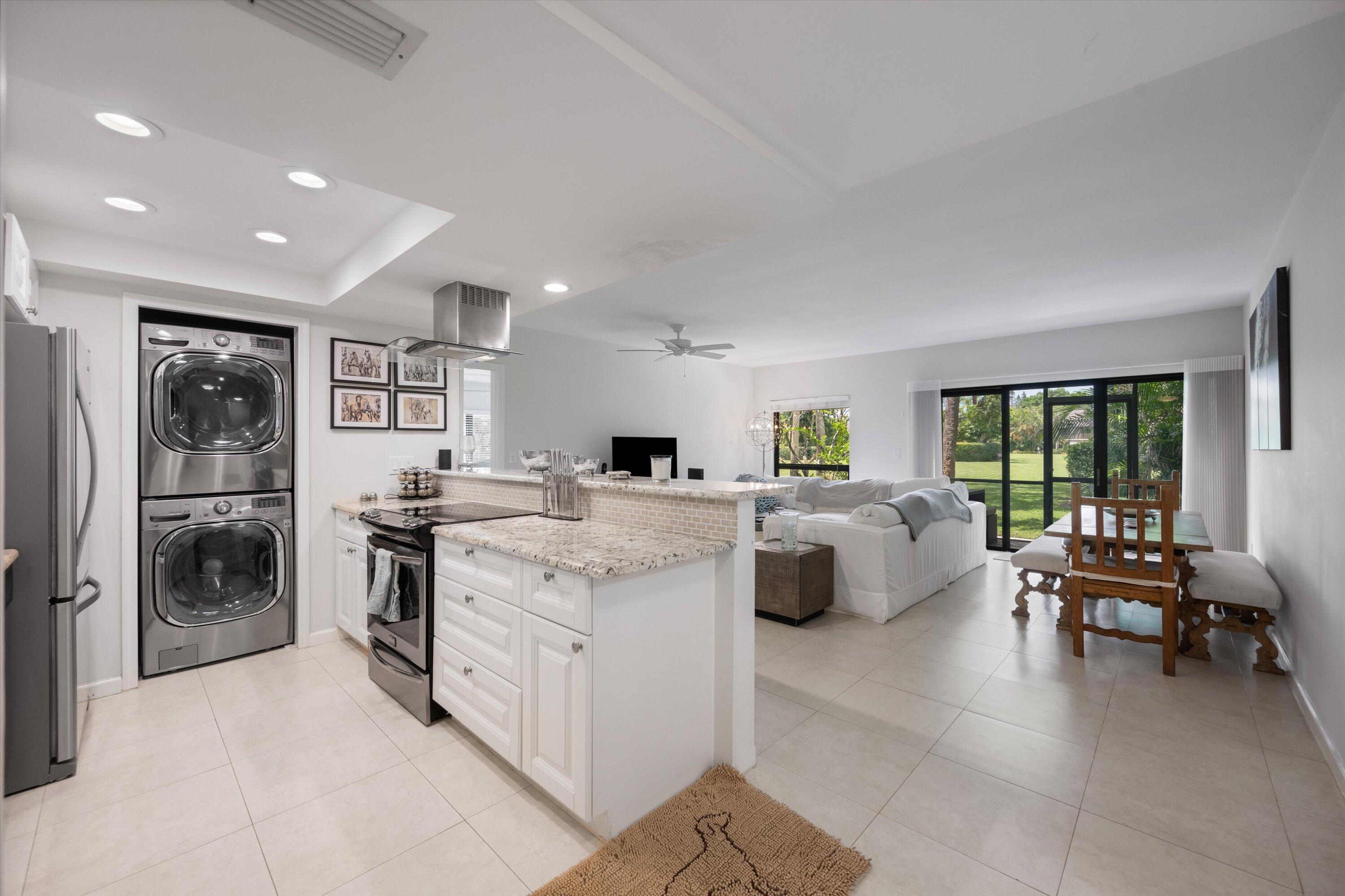 13334 Polo Club Road, Unit 228 Wellington, FL 33414 - Photo 3 of 24 View of Kitchen & Great Room