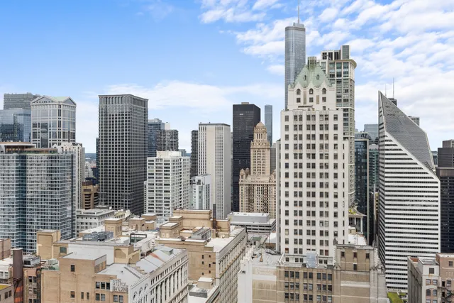 a view of city with tall buildings