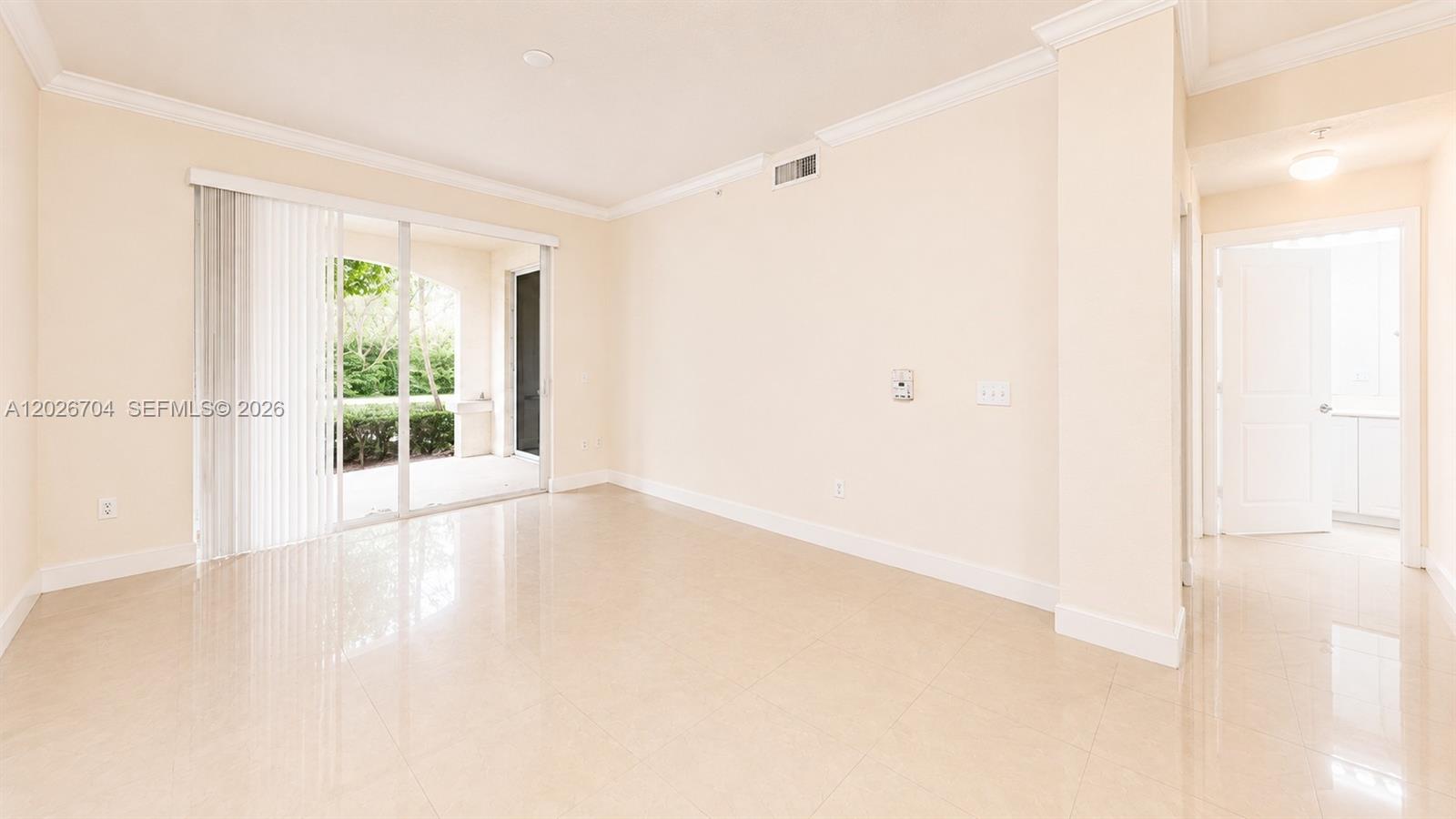 4106 Renaissance Way, Unit 106 Boynton Beach, FL 33426 - Photo 6 of 14 a view of an empty room with wooden floor