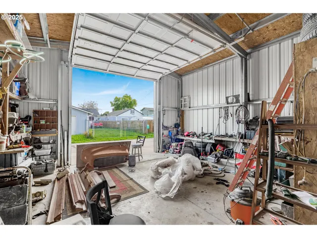 a view of a patio with table and chairs potted plants with wooden floor