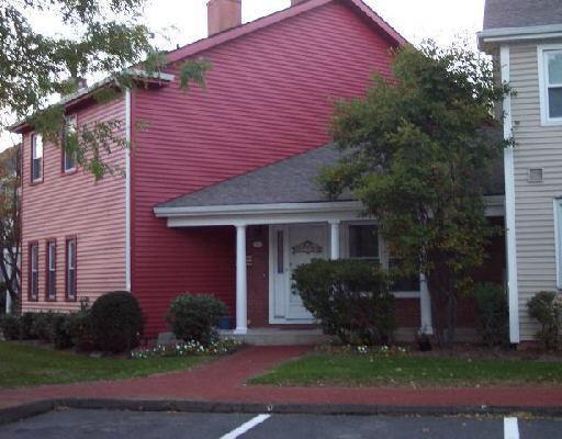 1 East Hayestown Road, Unit 42 Danbury, CT 06811 - Photo 1 of 1 a front view of a house with garden