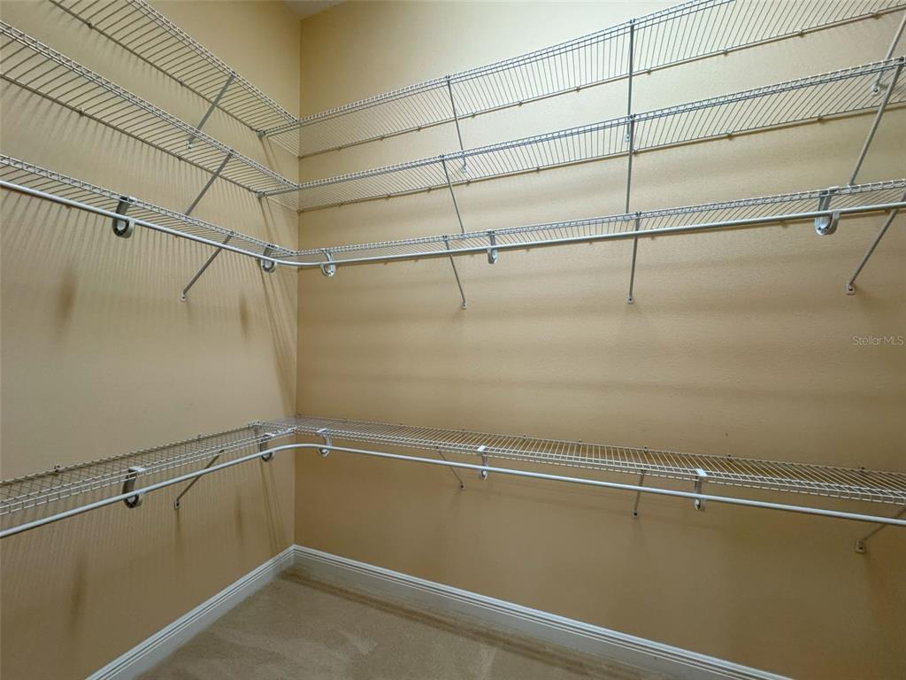 1024 West Beagle Run Loop Hernando, FL 34442 - Photo 30 of 44 a view of a room with racks on the wall