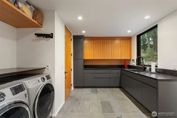 a utility room with closet dryer and washer