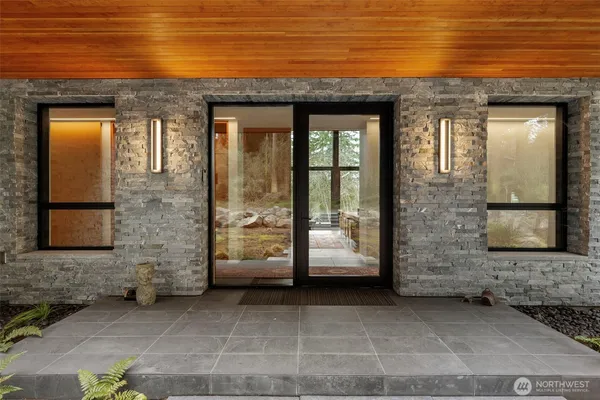 a view of a brick house with a red door