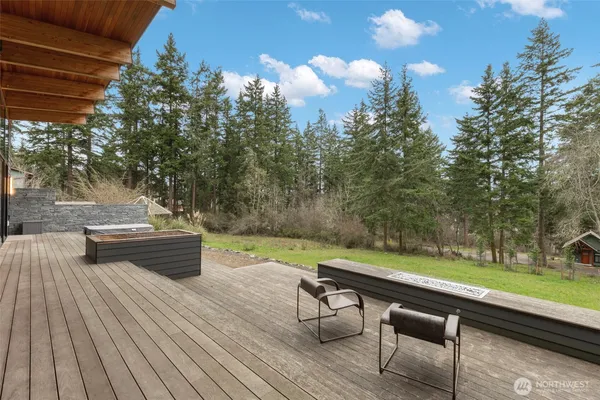 a view of a backyard with sitting area