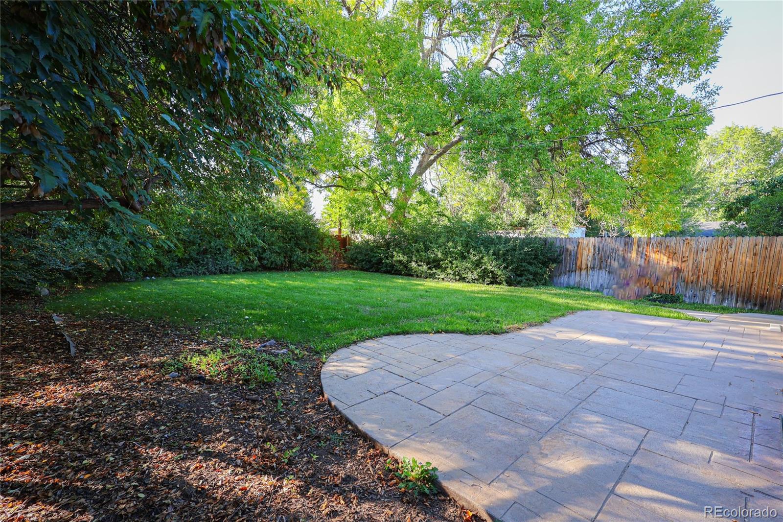 1045 Locust Street Denver, CO 80220 - Photo 17 of 18 a view of a backyard with green space