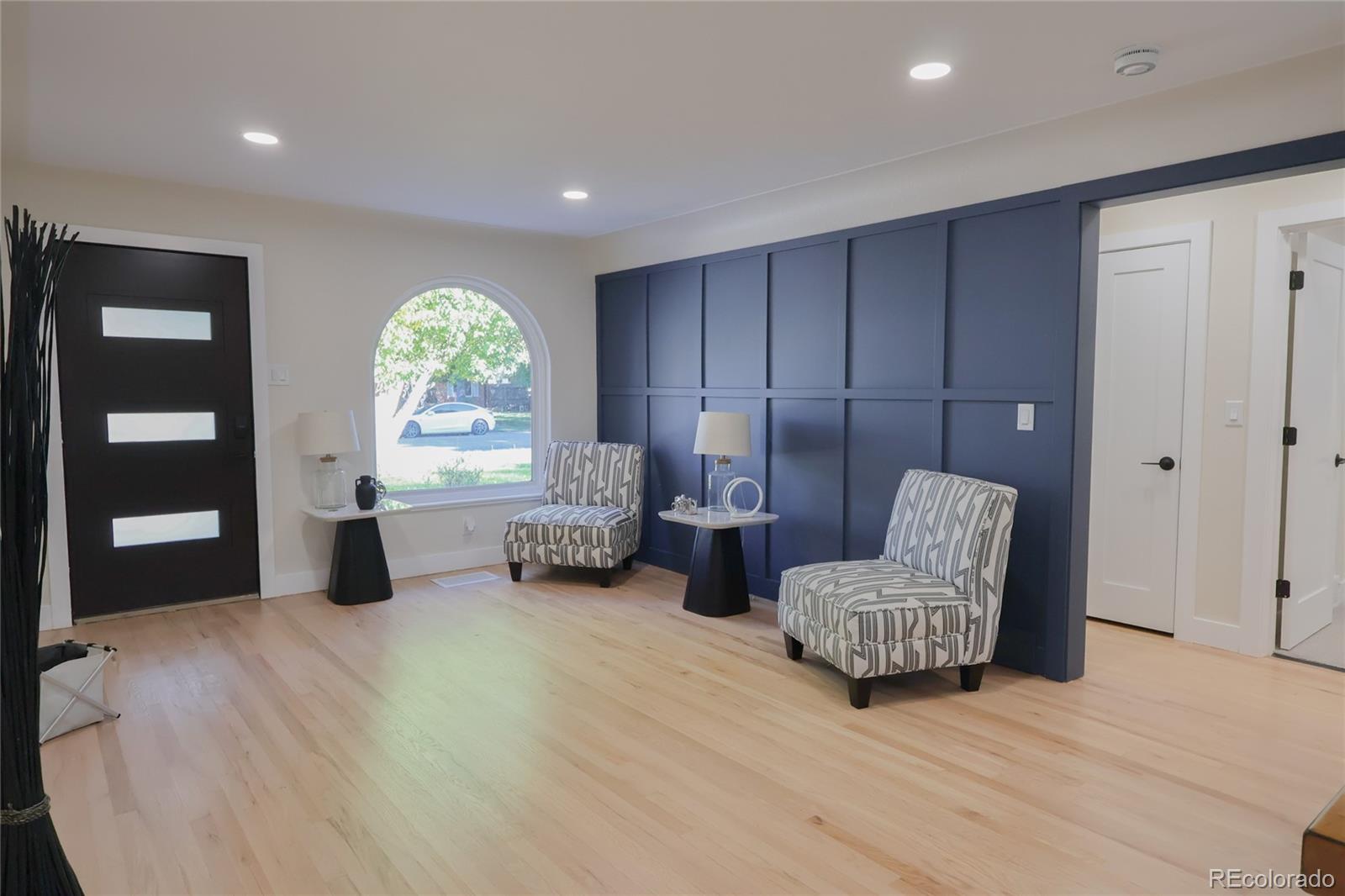 1045 Locust Street Denver, CO 80220 - Photo 5 of 18 a bedroom with furniture and a large window