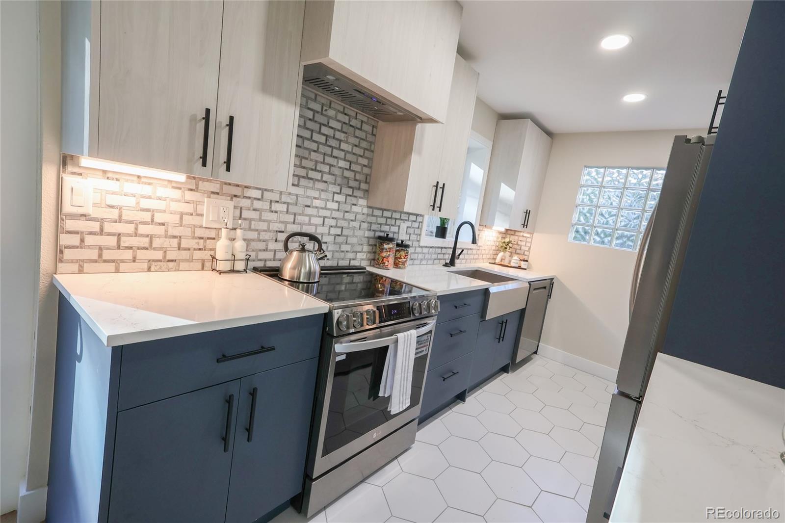 1045 Locust Street Denver, CO 80220 - Photo 6 of 18 a kitchen with a sink stove and cabinets