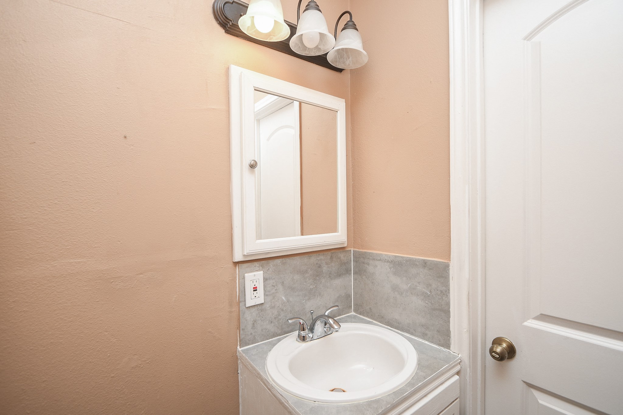 5411 Regal Ridge Lane Houston, TX 77053 - Photo 14 of 20 a bathroom with a sink and a mirror