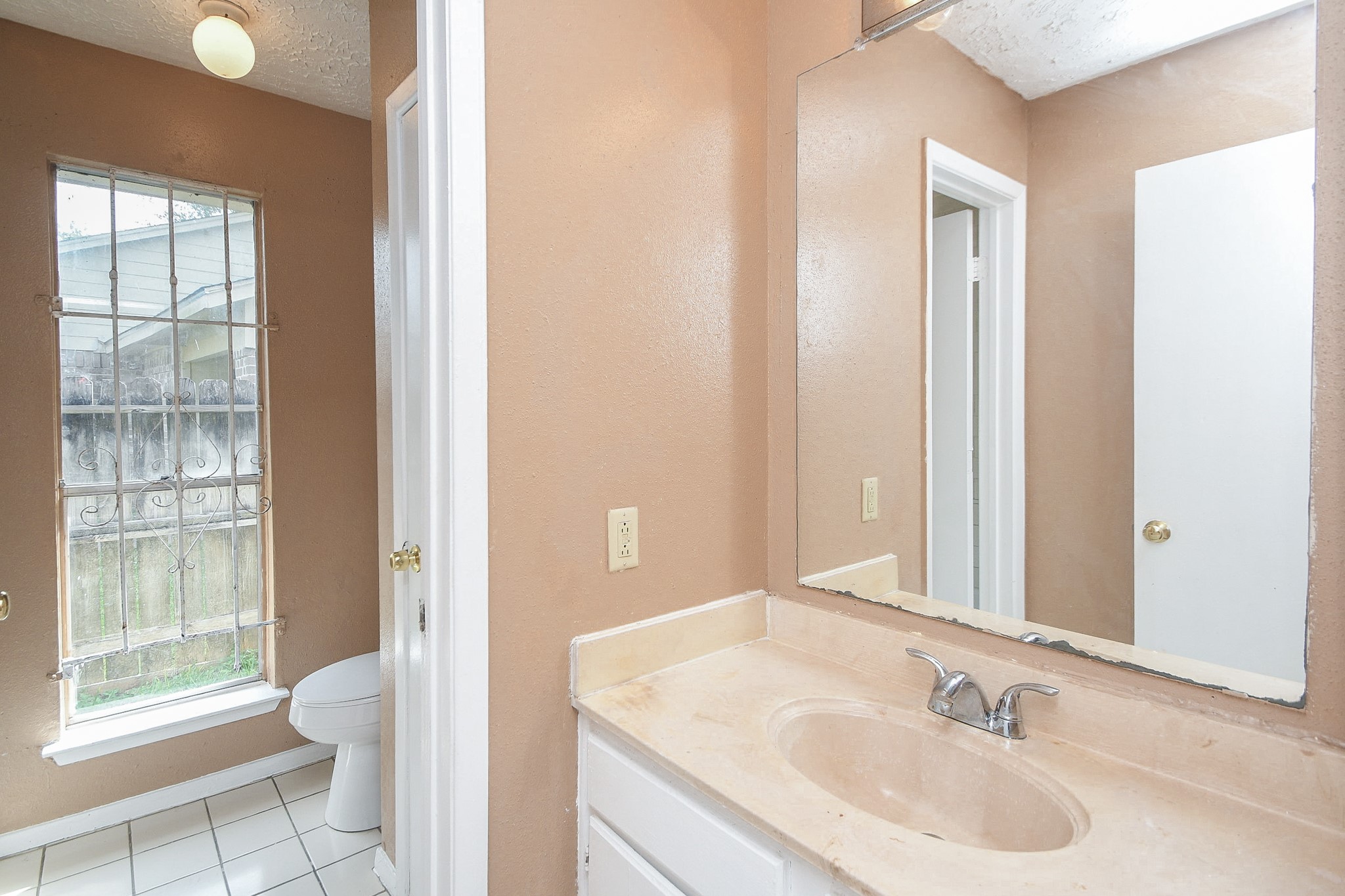 5411 Regal Ridge Lane Houston, TX 77053 - Photo 18 of 20 a bathroom with a sink and a large mirror