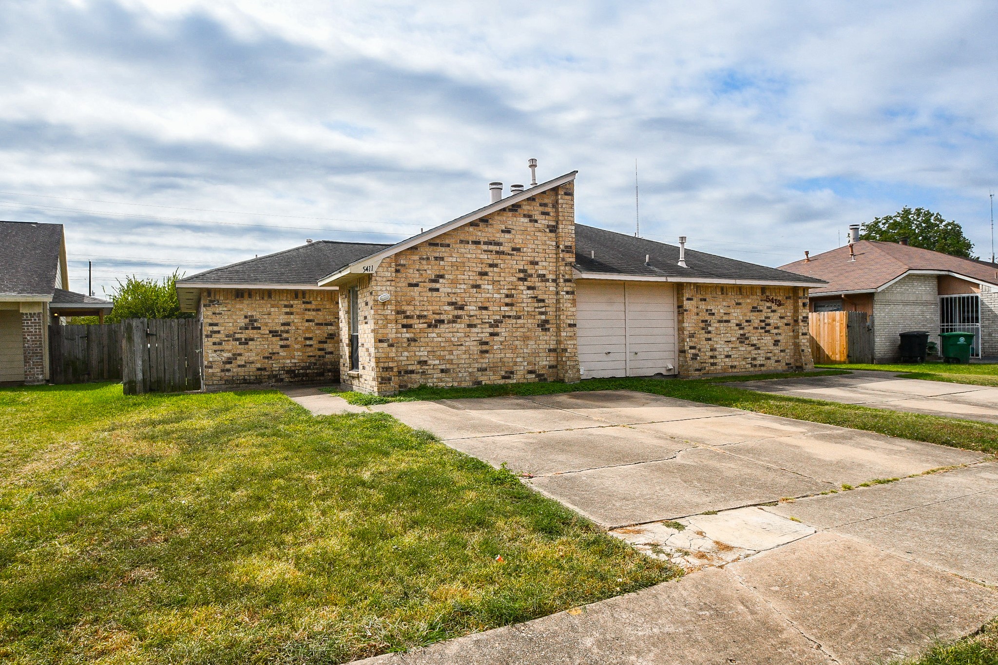 5411 Regal Ridge Lane Houston, TX 77053 - Photo 2 of 20 a view of a house with a yard and garage