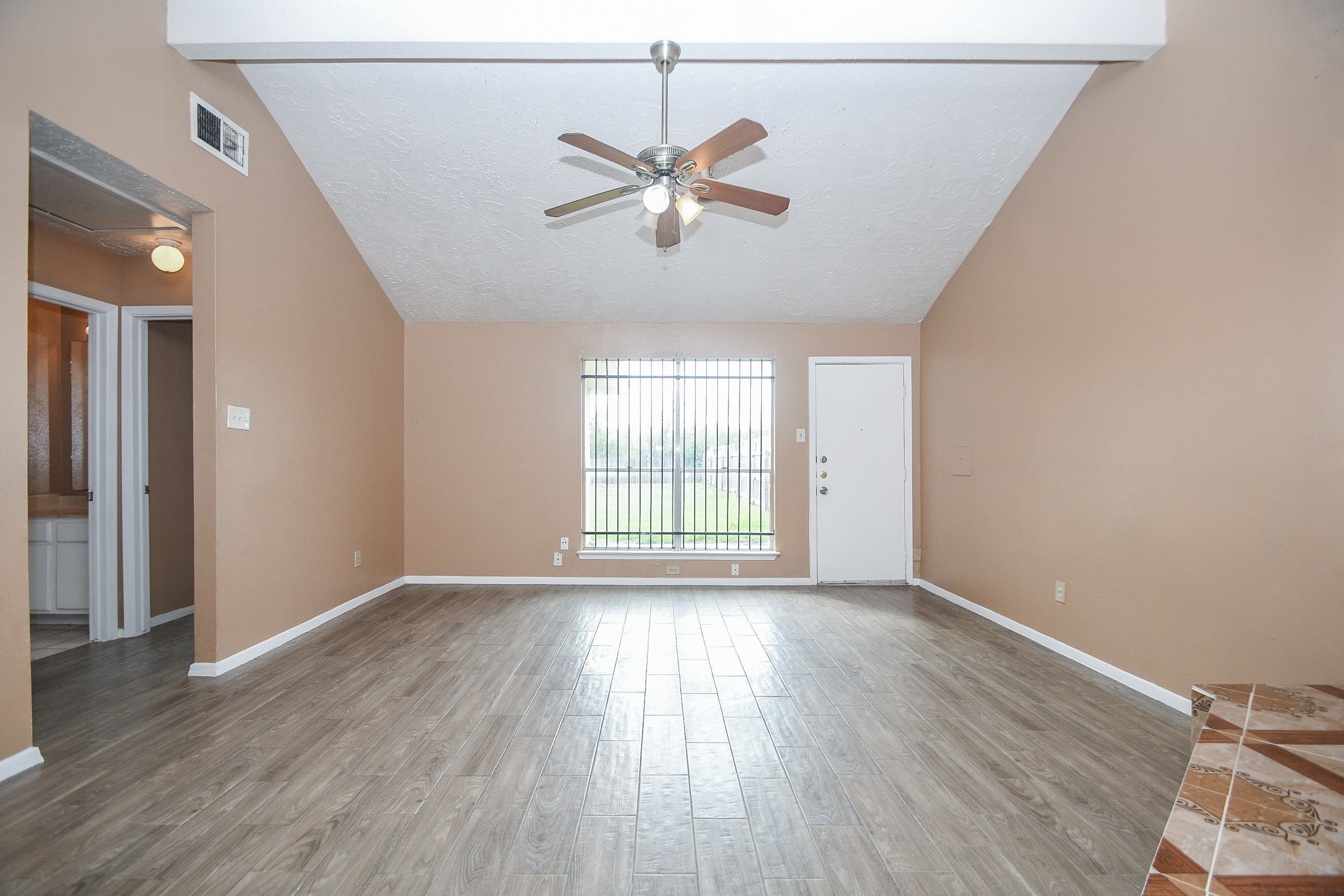 5411 Regal Ridge Lane Houston, TX 77053 - Photo 3 of 20 wooden floor in an empty room with a window