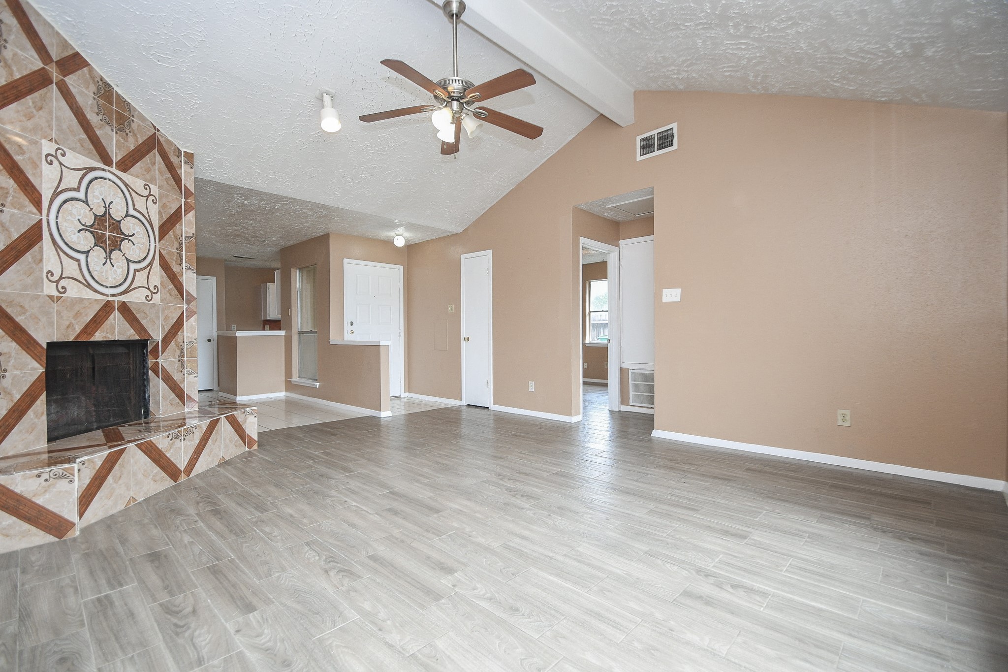5411 Regal Ridge Lane Houston, TX 77053 - Photo 5 of 20 an empty room with wooden floor and windows