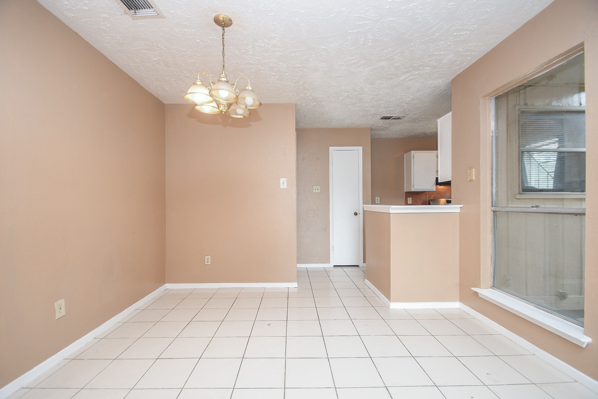 5411 Regal Ridge Lane Houston, TX 77053 - Photo 7 of 20 a view of a kitchen with cabinet and a chandelier fan