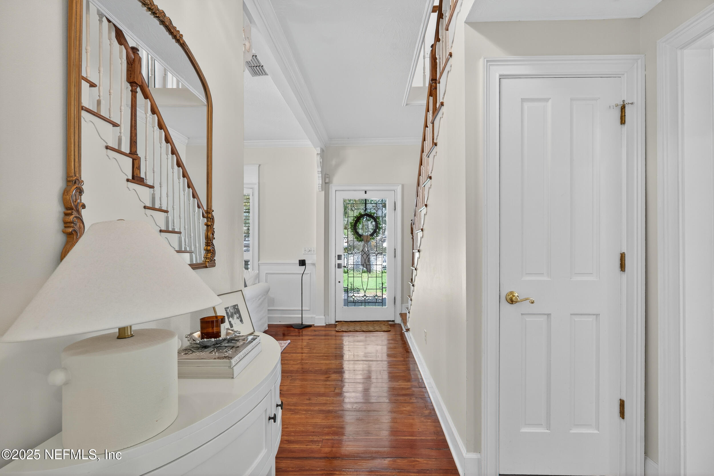 2734 Loretto Road Jacksonville, FL 32223 - Photo 12 of 35 a very nice looking room with wooden floor and stairs