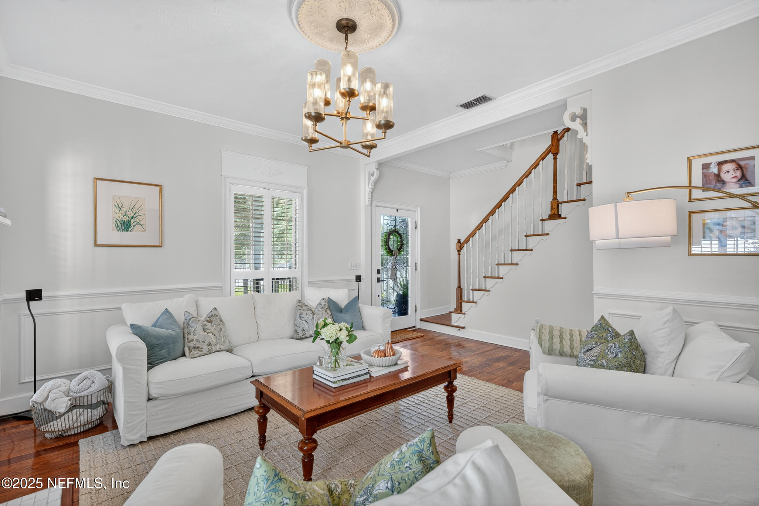 2734 Loretto Road Jacksonville, FL 32223 - Photo 14 of 35 a living room with furniture and a chandelier