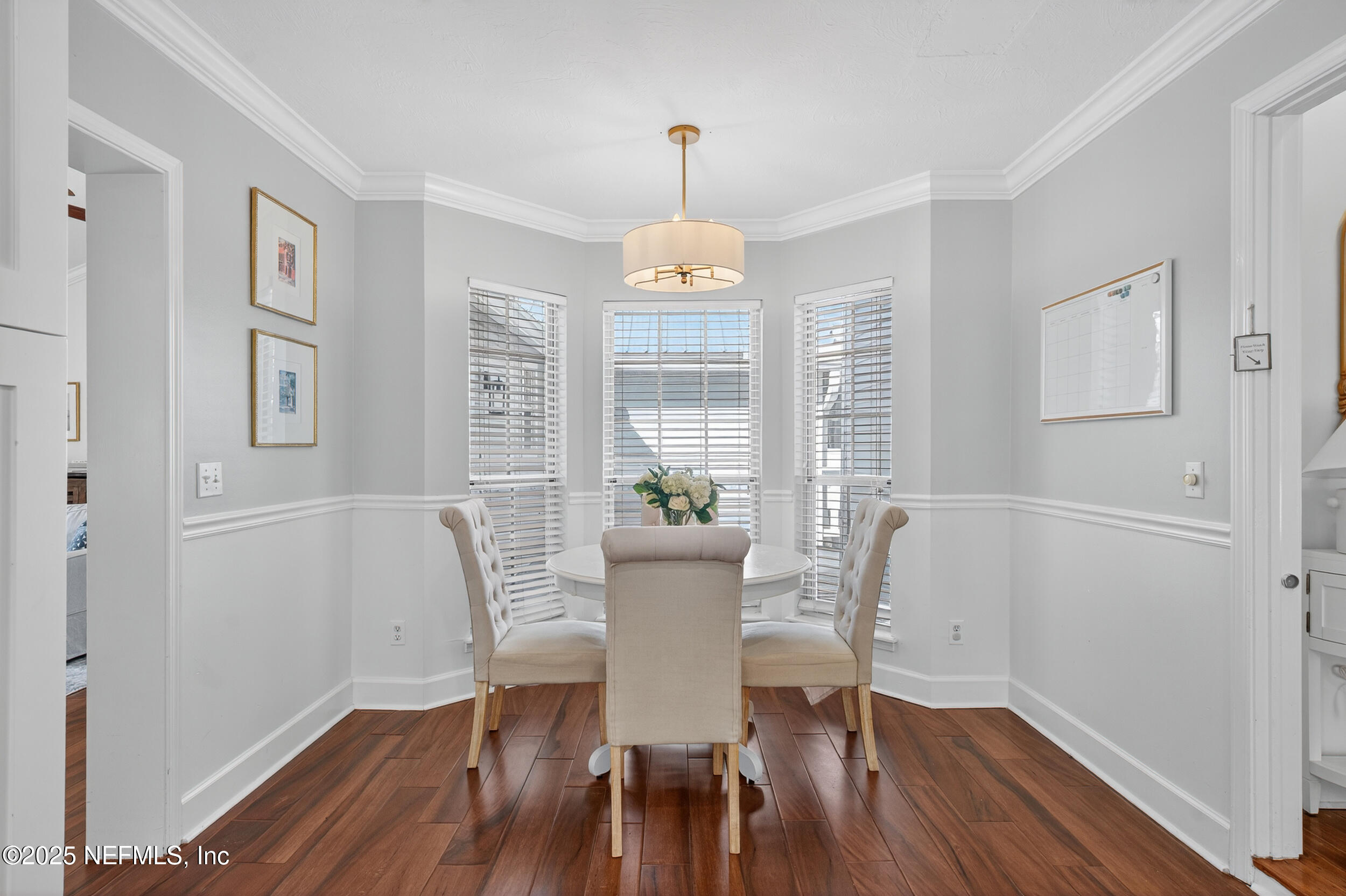 2734 Loretto Road Jacksonville, FL 32223 - Photo 17 of 35 a view of a dining room with furniture window and wooden floor
