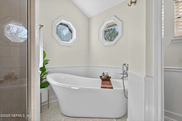a white bath tub sitting in a bathroom