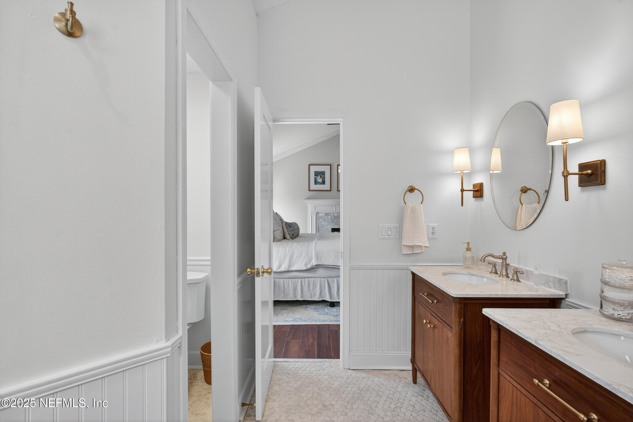 2734 Loretto Road Jacksonville, FL 32223 - Photo 22 of 35 a bathroom with a double vanity sink and a mirror