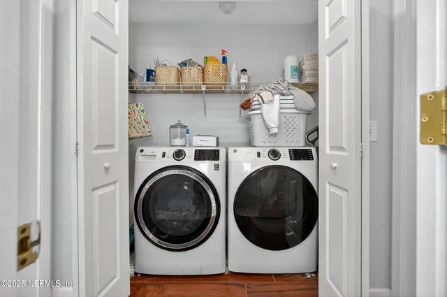 a utility room with dryer and washer