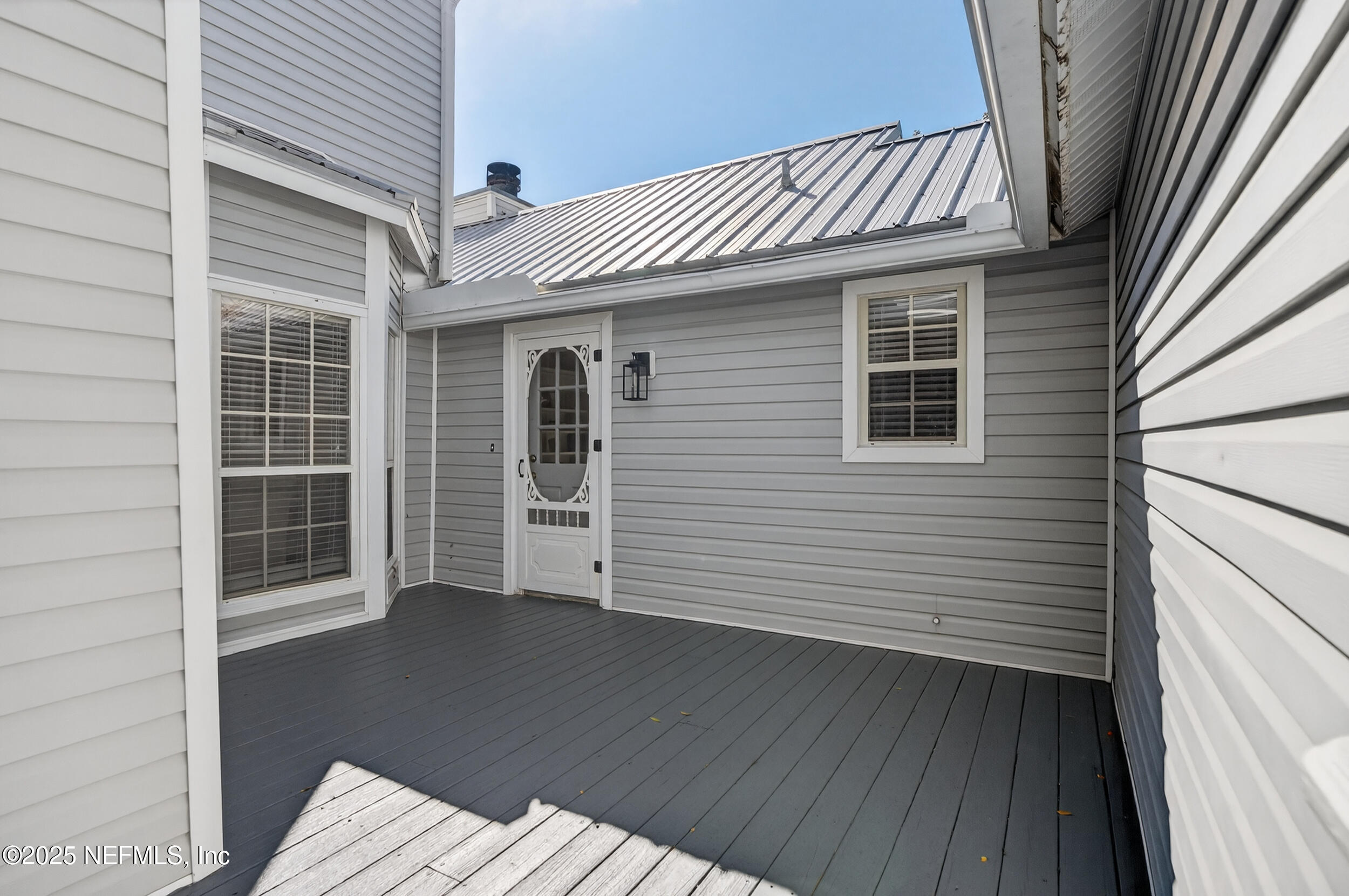 2734 Loretto Road Jacksonville, FL 32223 - Photo 31 of 35 a view of a house with wooden deck