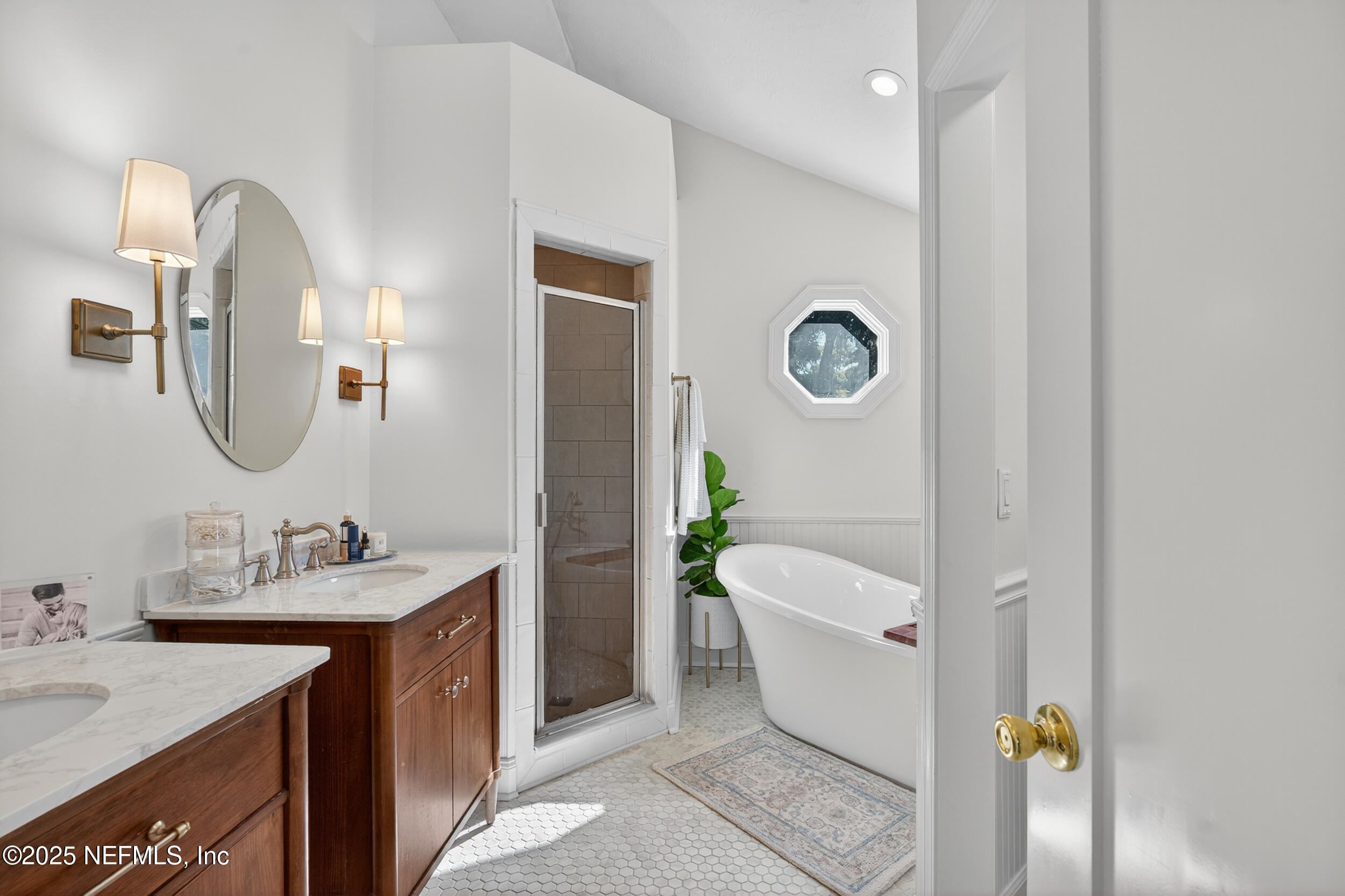 2734 Loretto Road Jacksonville, FL 32223 - Photo 4 of 35 a spacious bathroom with a granite countertop tub sink and mirror
