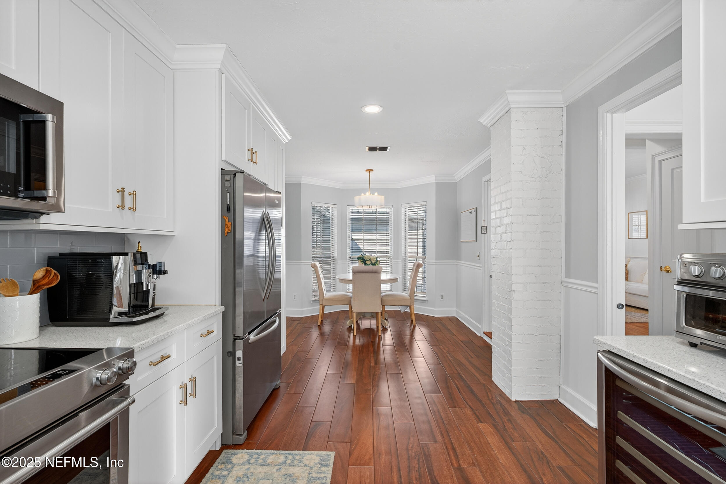 2734 Loretto Road Jacksonville, FL 32223 - Photo 5 of 35 a kitchen with stainless steel appliances a stove a sink a refrigerator and wooden floor