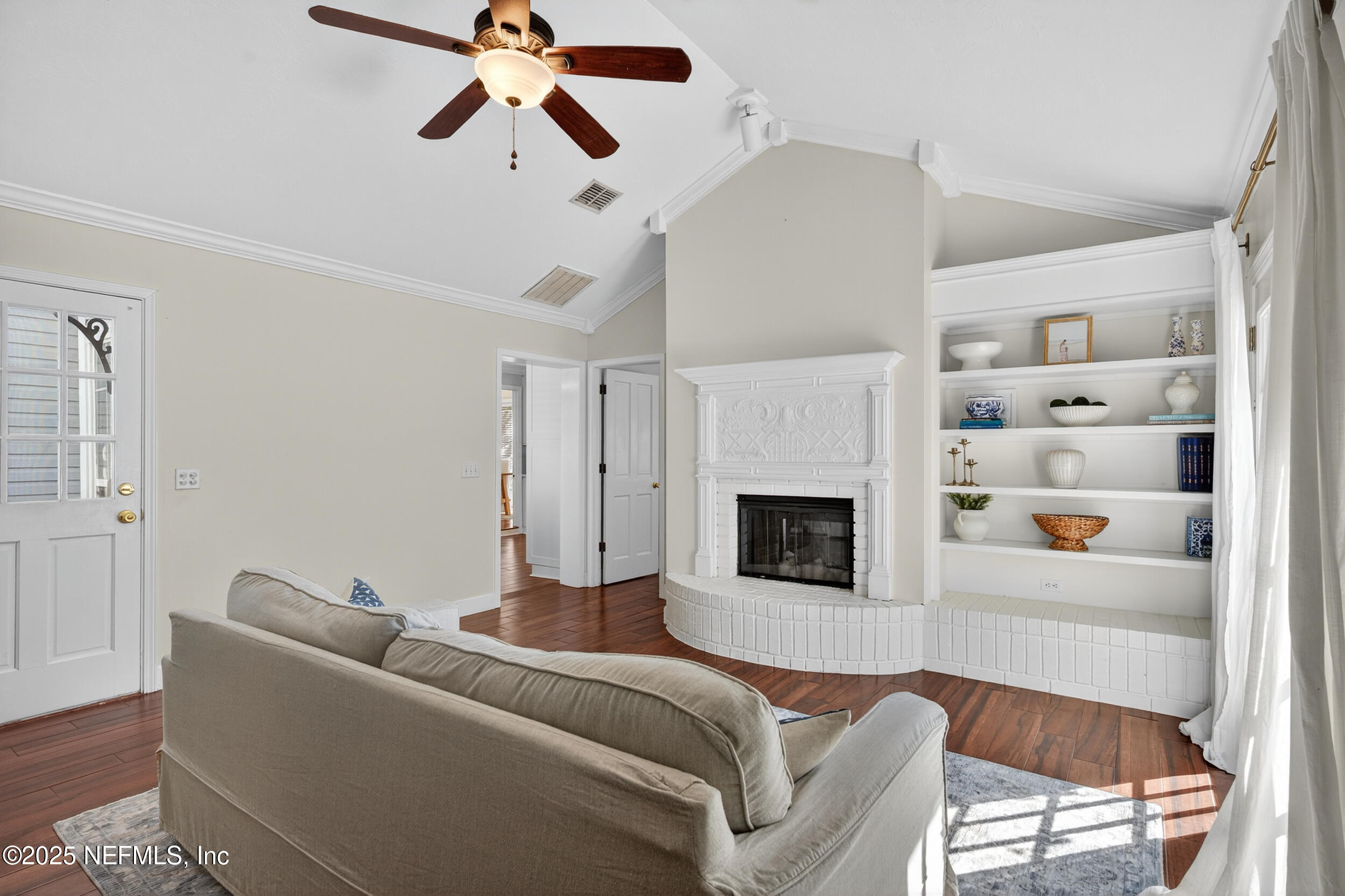 2734 Loretto Road Jacksonville, FL 32223 - Photo 9 of 35 a living room with furniture and a fireplace