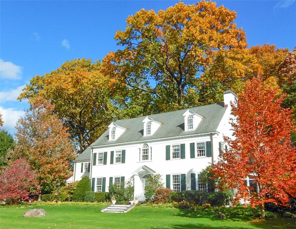 20 Beech Tree Lane Pelham, NY 10803 - Photo 1 of 1 a front view of a house with a garden
