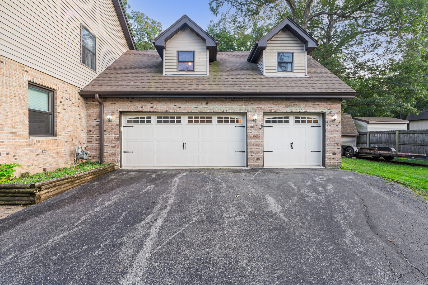5705 Timber Lane West Monee, IL 60449 - Photo 36 of 52 a front view of a house with a yard and garage