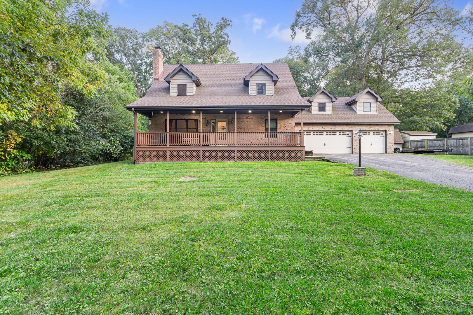5705 Timber Lane West Monee, IL 60449 - Photo 38 of 52 a front view of a house with a yard and large trees
