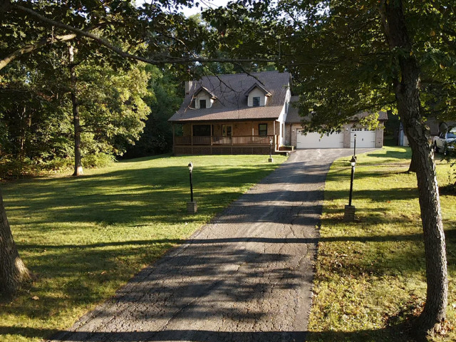 5705 Timber Lane West Monee, IL 60449 - Photo 49 of 52 a front view of a house with a garden and trees