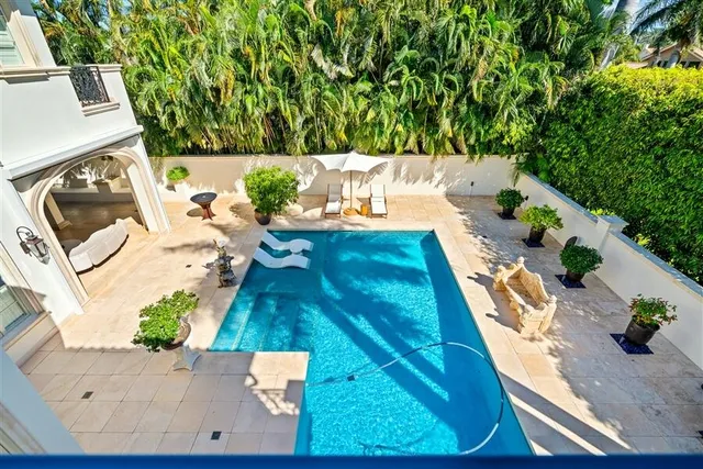a view of a swimming pool with a patio