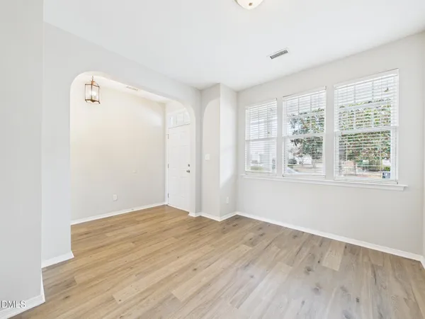 a kitchen with stainless steel appliances granite countertop a refrigerator a stove top oven a sink and dishwasher