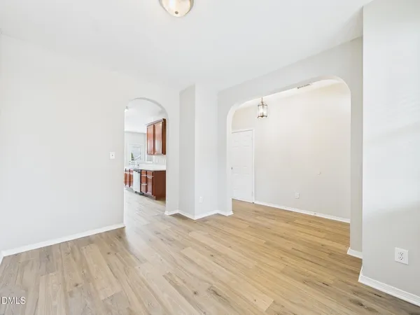 a kitchen with stainless steel appliances granite countertop lots of counter top space and wooden floor